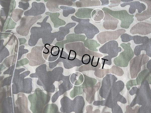 背中に小さな傷。